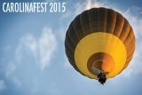 A hot air balloon with a yellow and brown design floats against a blue sky with wispy clouds. The text "CAROLINAFEST 2015" is in the top left corner.