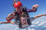 Tandem skydiving pair in freefall