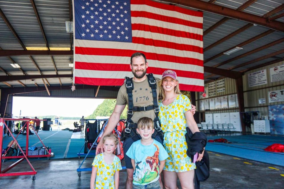 family-poses-in-skydive-carolina-hangar