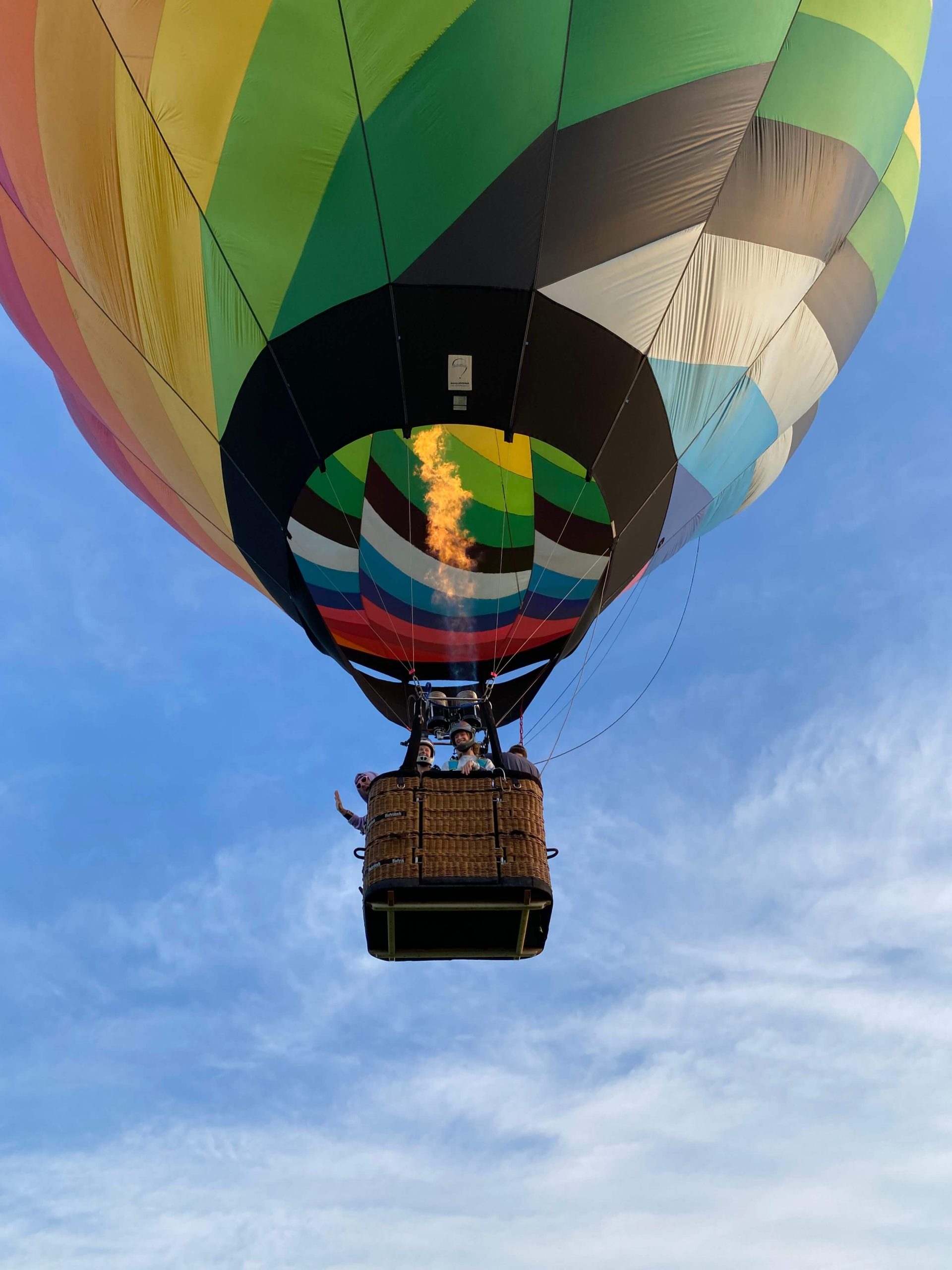 hot air balloon carrying skydivers at lift off 