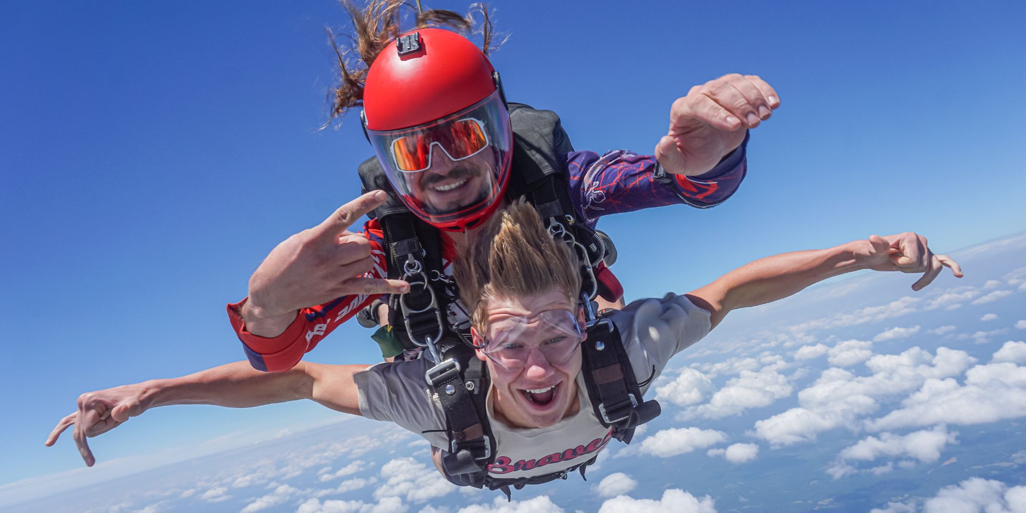 Tandem skydiving pair in freefall 